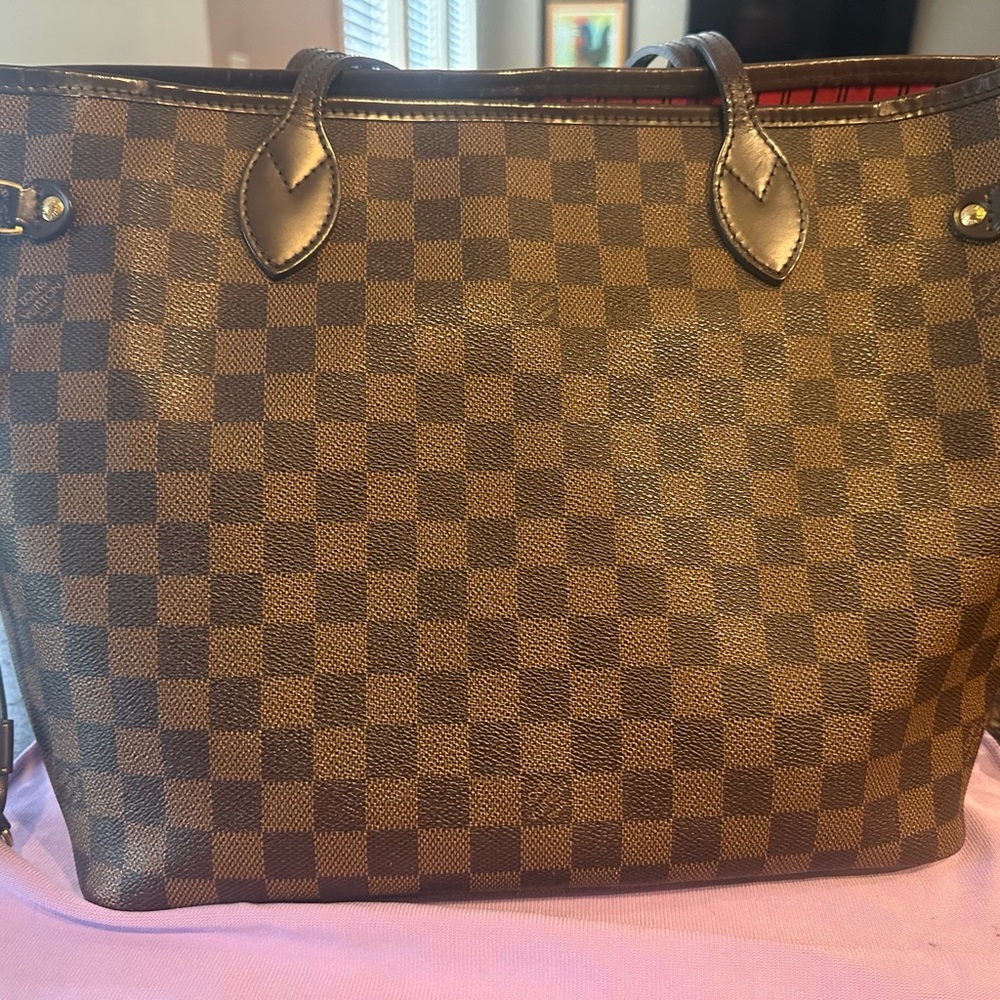 Authentic gently used Louis Vuitton MM DE.